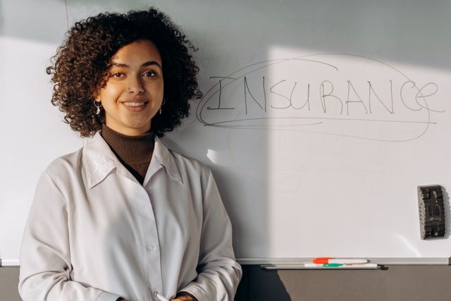 AI insurance exclusion small business" — flat conceptual icon of an insurance document with a highlighted redacted line, muted slate/amber palette