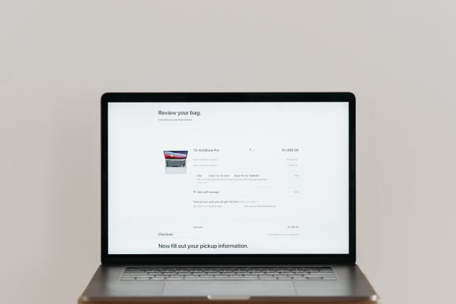 detect AI agent traffic website" — flat conceptual icon of a magnifying glass over a browser window with a faint bot silhouette, muted teal/slate palette